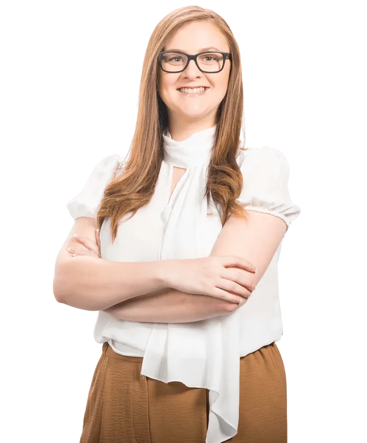 A Viva executive assistant, smiling with arms crossed